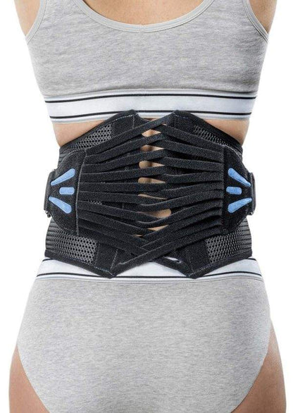M-Brace 505 Lumbar Sacral Brace worn by person for back support and sciatica relief.