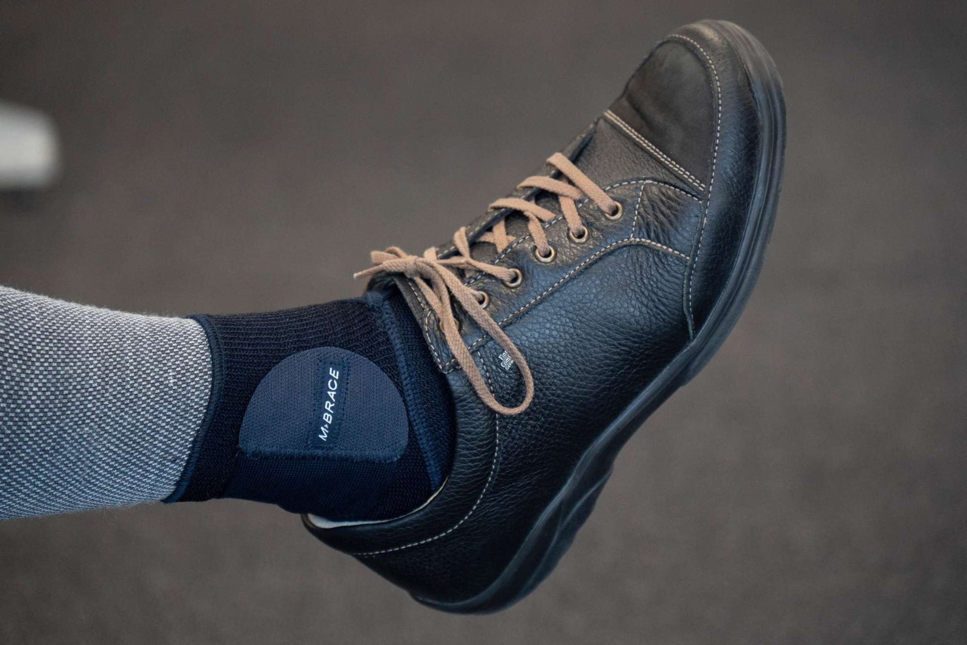 M-Brace Strenua Extra Ankle Lock worn with a shoe, showcasing the comfortable, breathable design.
