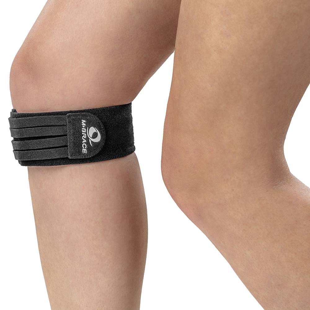 M-Brace Jumpers Knee Compression Brace on leg, provides support for Osgood Schlatter's Disease and patellar tendonitis.