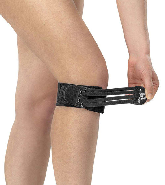 M-Brace Jumpers Knee Compression Brace on leg for patellar tendonitis support.