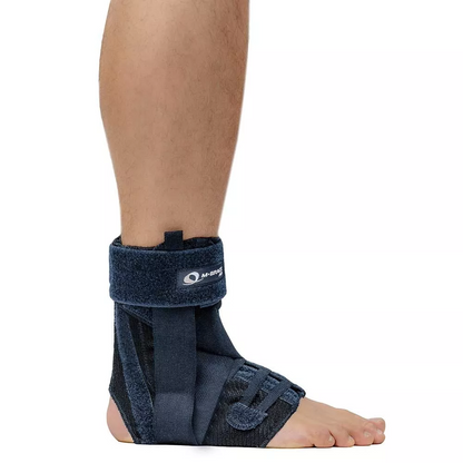 M-Brace Salto Ankle Stabilizer worn on foot, providing support and control for ankle movements.